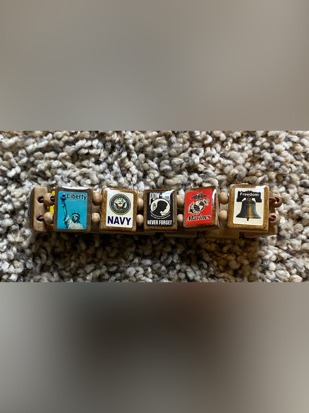 Patriotic wooden stretch bracelet manufactured by Wrist Story Products.